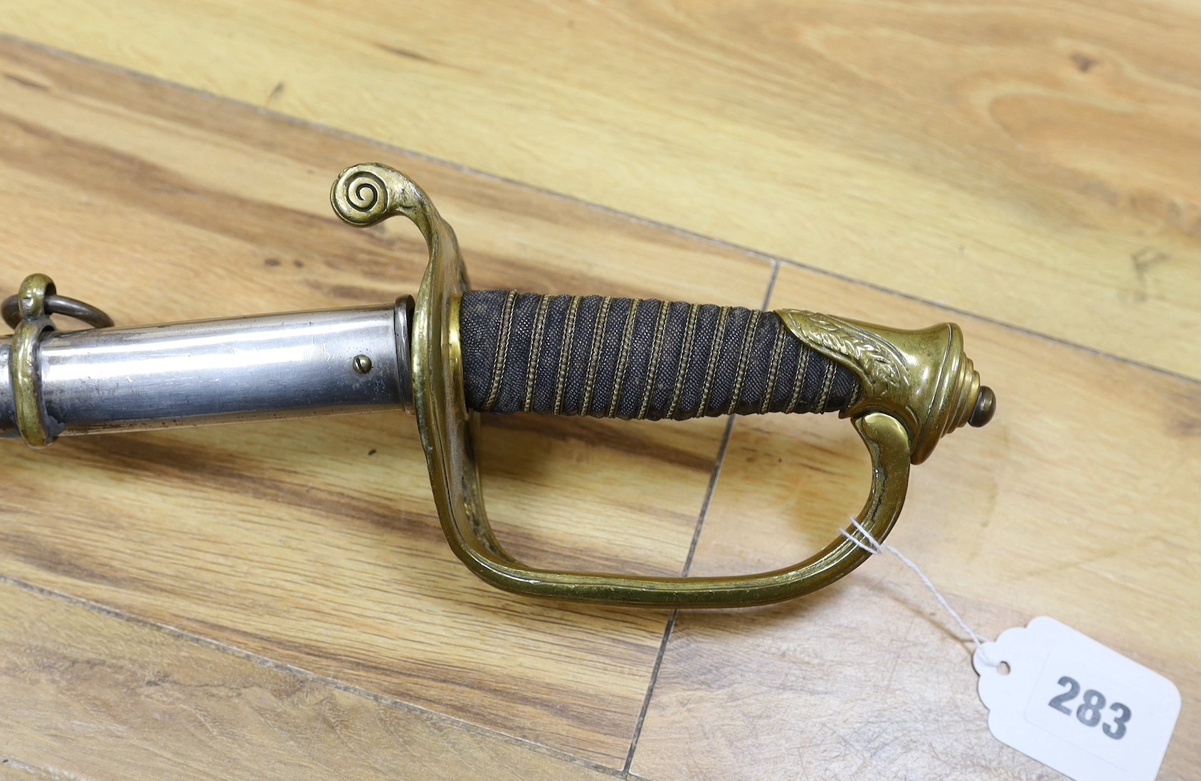 A United States Marines dress sword made by Wilkinson, the blade etched ‘S/SGT. JAMES P.S. DEVEREUX II. 1340836 U.S.M.C.’ with scabbard. Total length 107cm